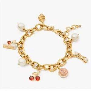kate spade Gold Tone Charm Bracelet with Pearls and Red Crystal Charms